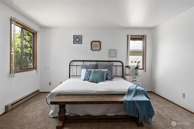 bedroom featuring baseboard heating and carpet flooring