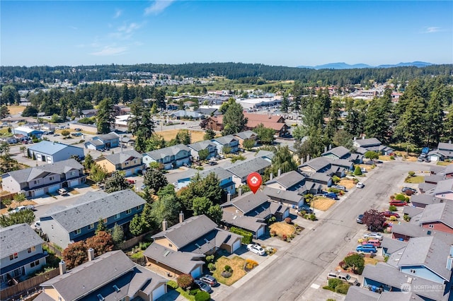 birds eye view of property with a mountain view