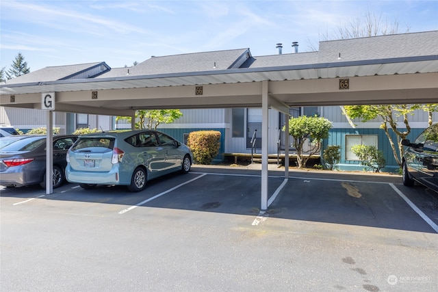 view of parking / parking lot with a carport