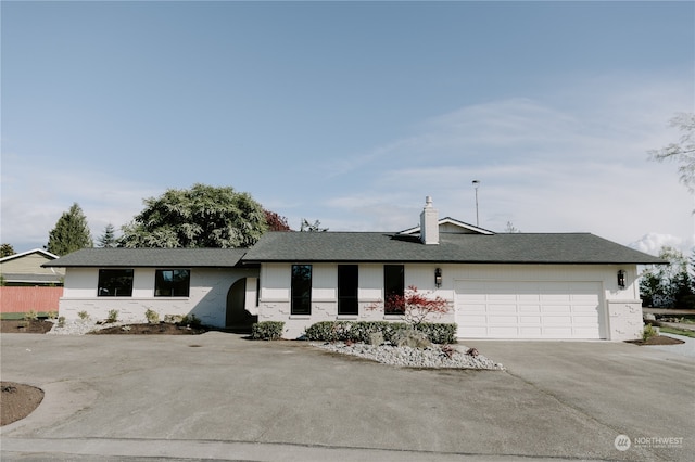 single story home with a garage