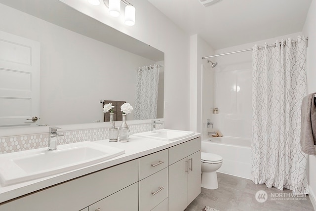 full bathroom featuring vanity, toilet, and shower / bathtub combination with curtain