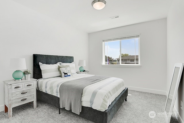 bedroom featuring light carpet