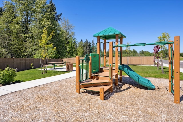 view of playground featuring a lawn