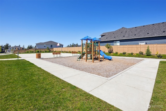 view of jungle gym with a lawn