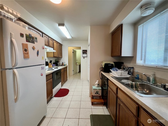 712714 142nd Pl SE, Bellevue, WA 98007 - kitchen with white appliances, light tile patterned floors, light countertops, and brown cabinets