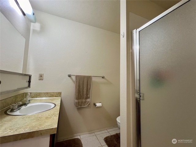 712714 142nd Pl SE, Bellevue, WA 98007 - bathroom featuring tile patterned flooring, a shower stall, and vanity