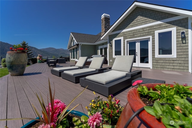 wooden terrace with a mountain view