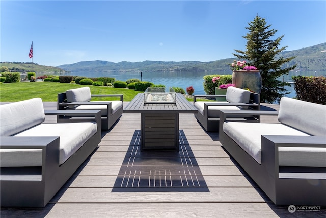 view of patio with an outdoor hangout area and a deck with water view