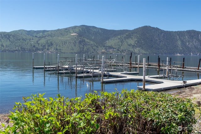 dock area featuring a water and mountain view