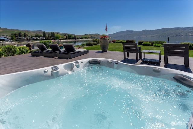 view of swimming pool featuring a deck with mountain view