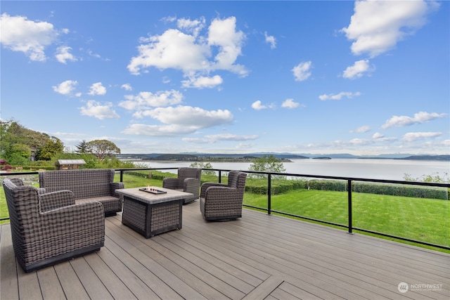 wooden deck with a water view