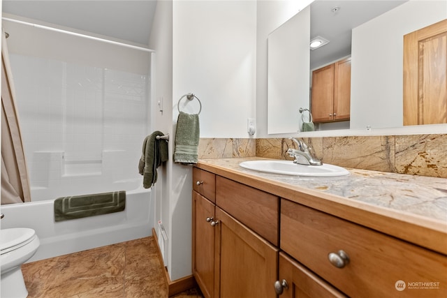 full bathroom with vanity, toilet, and shower / tub combo with curtain