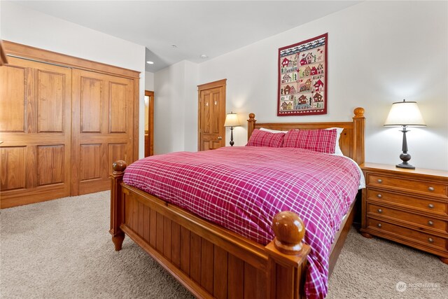 bedroom featuring light carpet