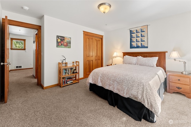 bedroom featuring a closet and carpet