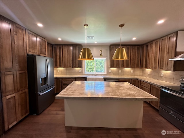 kitchen with electric range oven, stainless steel refrigerator with ice dispenser, dark hardwood / wood-style flooring, and a center island