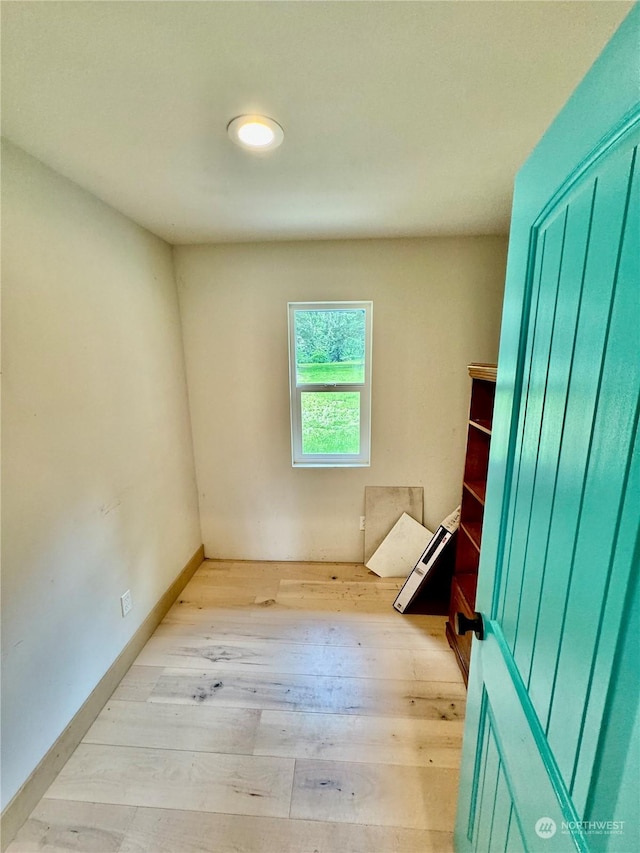 spare room with light hardwood / wood-style floors