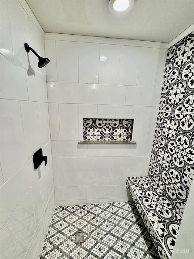 bathroom with tiled shower