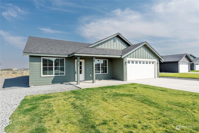 view of front of property with a garage and a front lawn