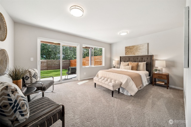 bedroom featuring access to outside and carpet flooring