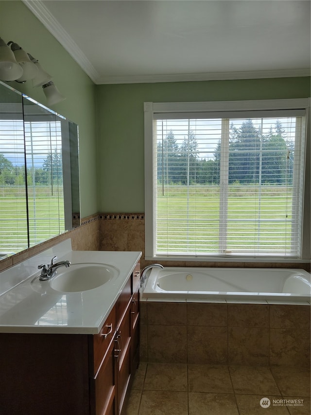 bathroom with a relaxing tiled bath, oversized vanity, ornamental molding, and tile floors