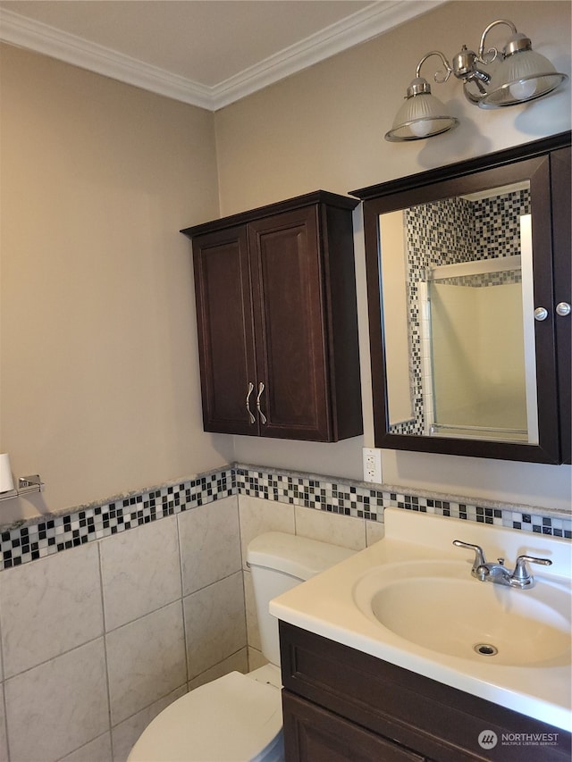 bathroom featuring ornamental molding, tile walls, toilet, and large vanity