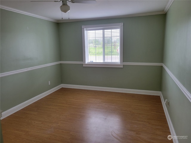 unfurnished room with crown molding, wood-type flooring, and ceiling fan