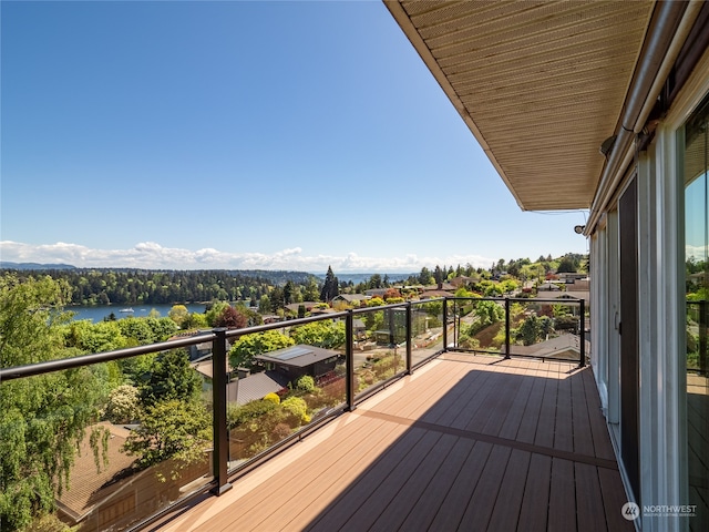 wooden deck with a water view