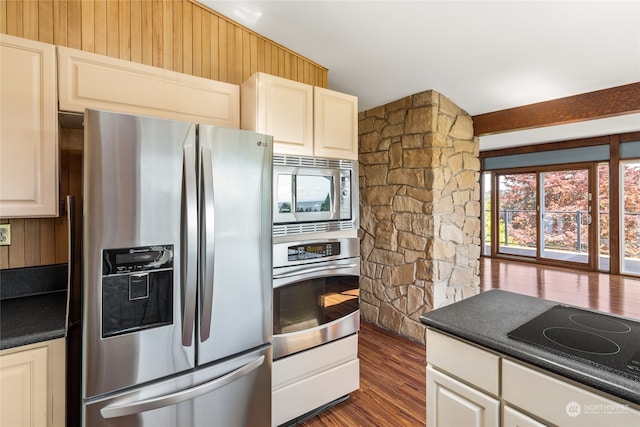 kitchen featuring dark wood-type flooring and stainless steel appliances