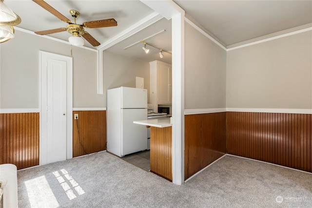 kitchen with white refrigerator, light carpet, ceiling fan, and rail lighting