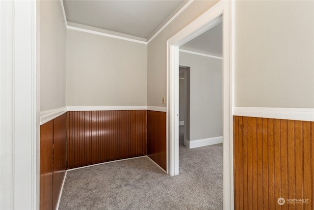 hall with crown molding and carpet flooring