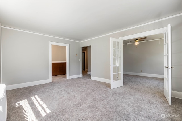 unfurnished bedroom featuring a closet, crown molding, and light colored carpet