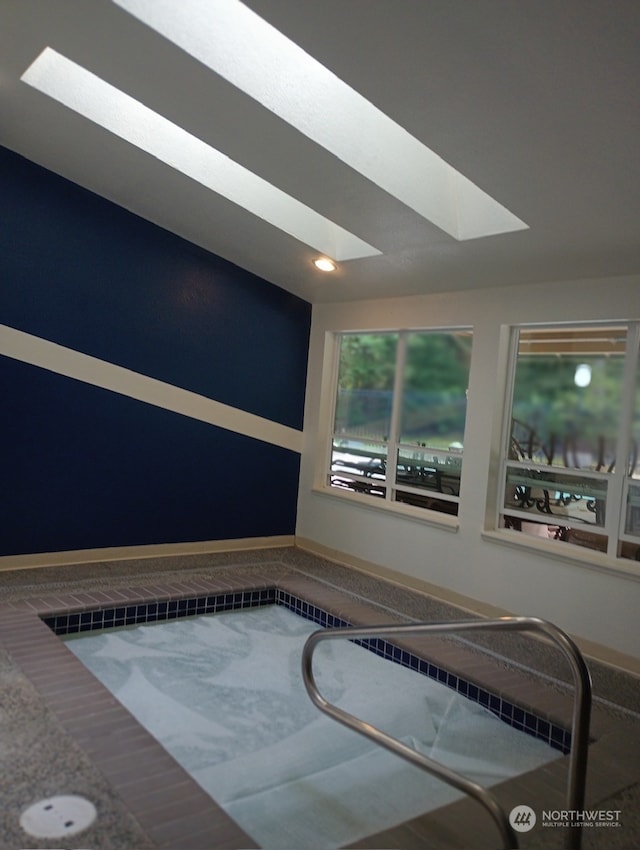 view of pool featuring an indoor hot tub