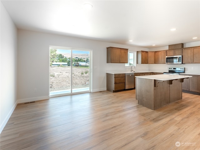 384 Emma Dr, Wenatchee, WA 98801 - kitchen featuring a center island, light wood-type flooring, sink, and appliances with stainless steel finishes