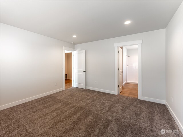 384 Emma Dr, Wenatchee, WA 98801 - unfurnished bedroom featuring ensuite bath and dark carpet