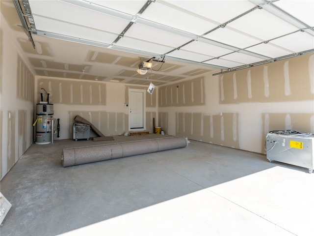 384 Emma Dr, Wenatchee, WA 98801 - garage with strapped water heater and a garage door opener
