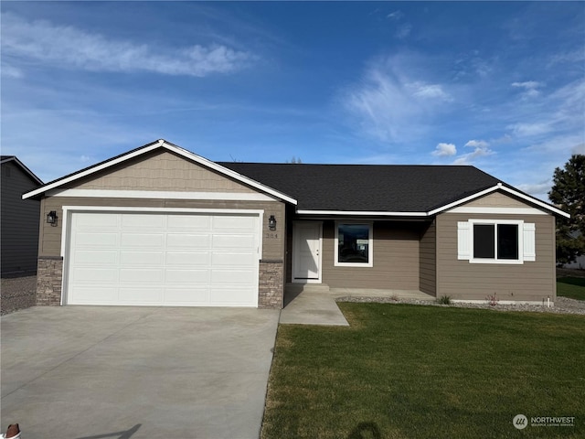 ranch-style home with a garage and a front lawn