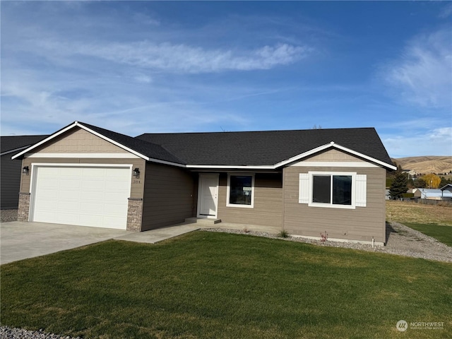 single story home featuring a front lawn and a garage