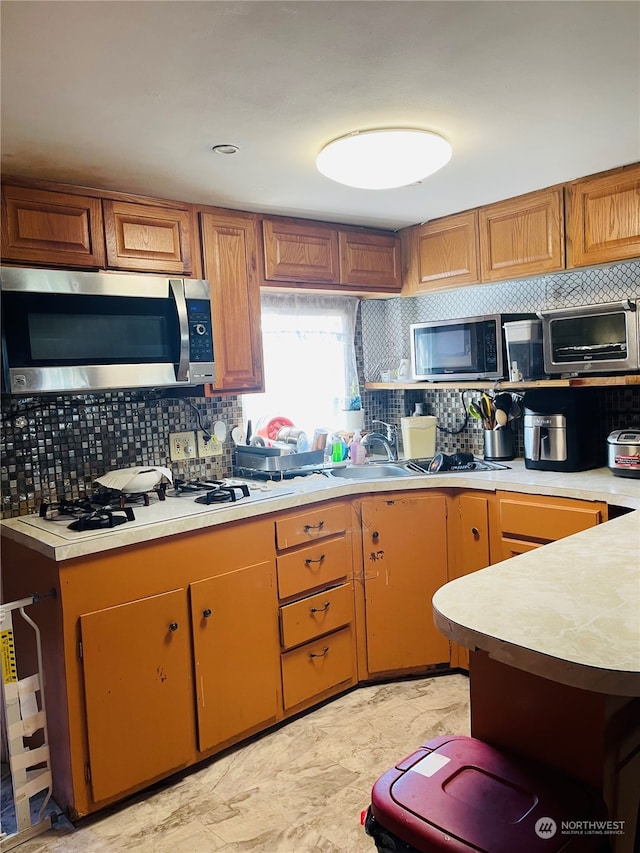 kitchen featuring decorative backsplash and white gas stovetop