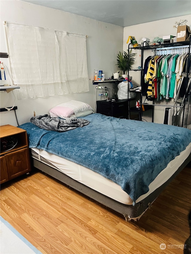 bedroom with light hardwood / wood-style flooring