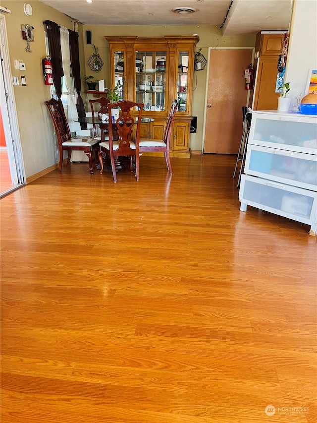 dining space featuring light wood-type flooring