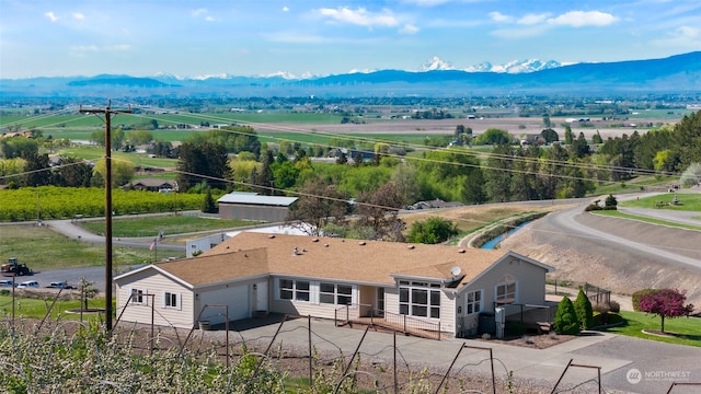 birds eye view of property with a mountain view