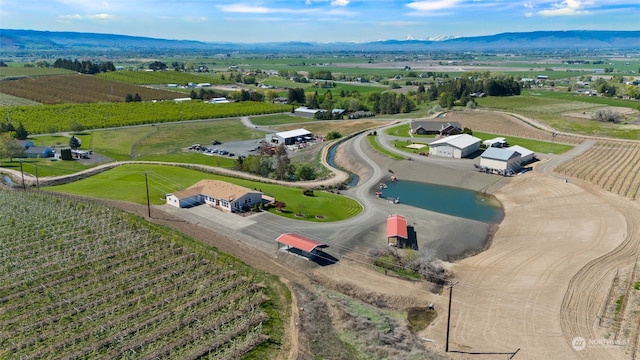 birds eye view of property with a rural view