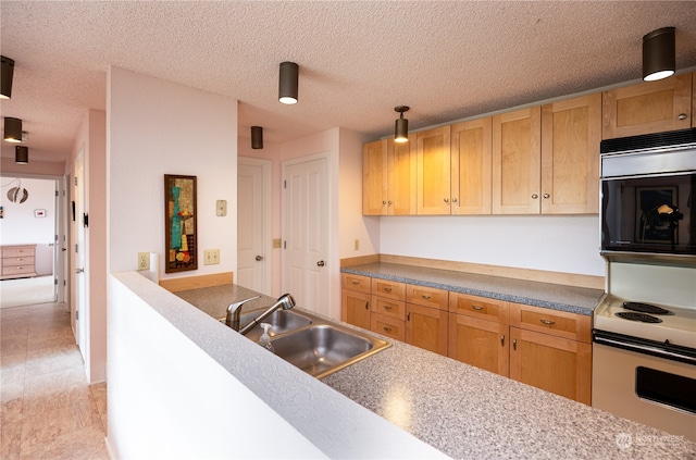 kitchen with light tile floors, sink, white range with electric stovetop, and a textured ceiling