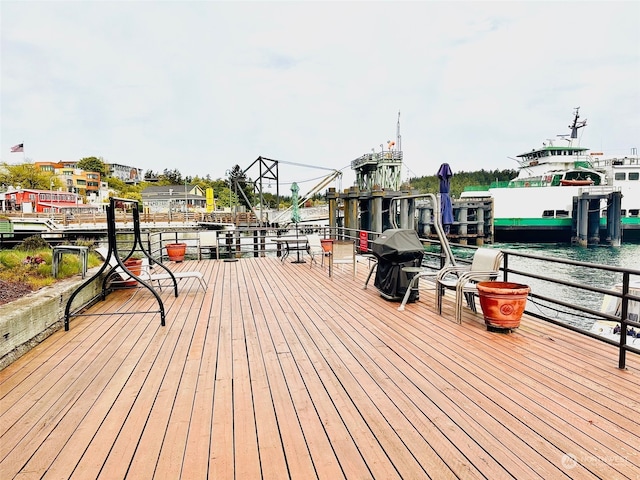 wooden deck featuring a water view