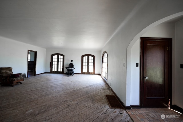 unfurnished living room with wood-type flooring