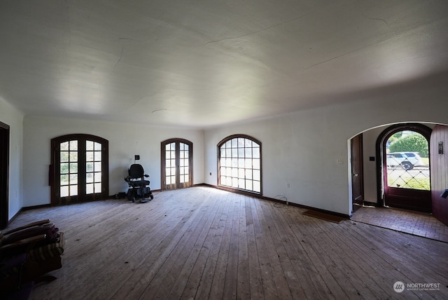 foyer entrance featuring french doors and hardwood / wood-style floors