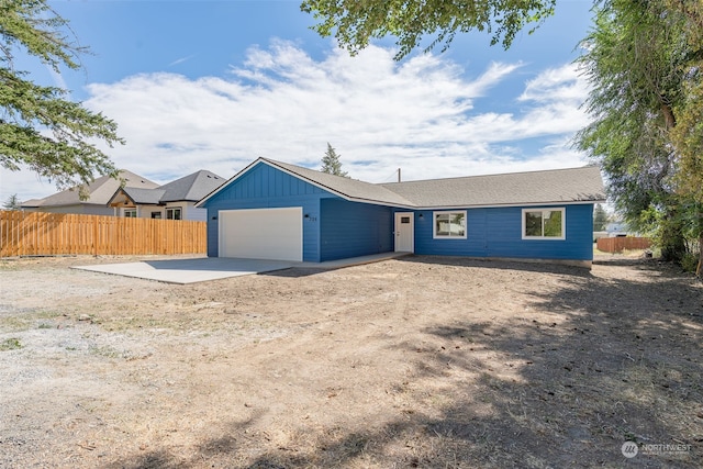 ranch-style house featuring a garage