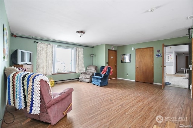 living room featuring hardwood / wood-style floors and a baseboard radiator