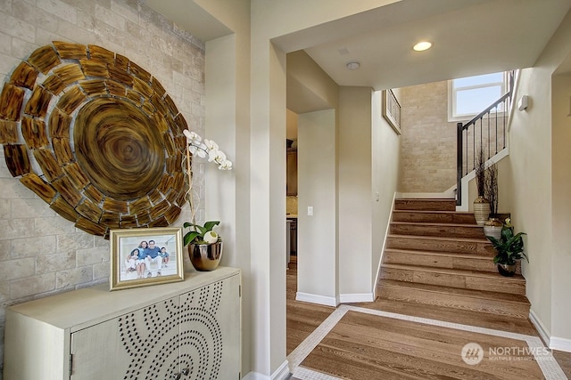 stairway featuring hardwood / wood-style floors