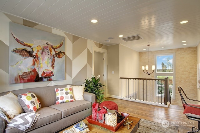 living room featuring a notable chandelier and hardwood / wood-style flooring